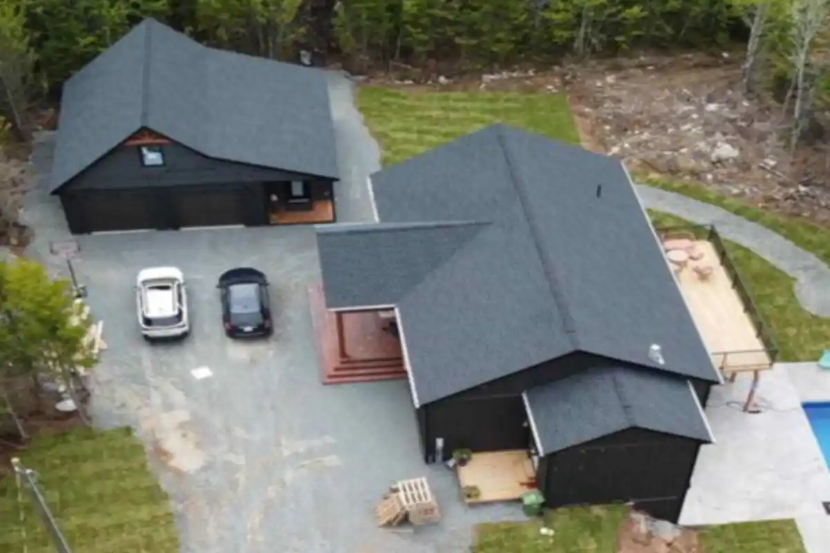 Aerial view of asphalt shingle roofs on home and detached garage in East Uniacke, Nova Scotia